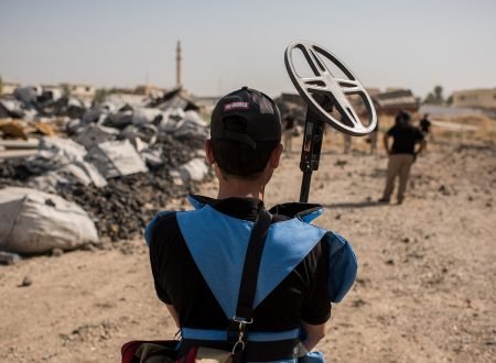 A UNMAS mine detection contractor waits during a clearance operation in Mosul, Iraq on August 29, 2017.